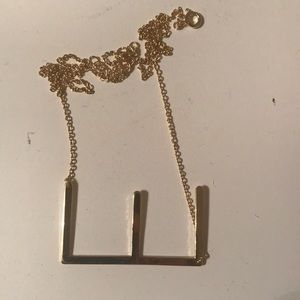 Brand new sideways "E" necklace